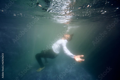 Lonely man drowsing in pool © ADDICTIVE STOCK CORE