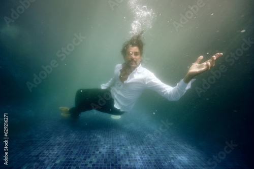 Wallpaper Mural Sad man drowning in water in pool Torontodigital.ca