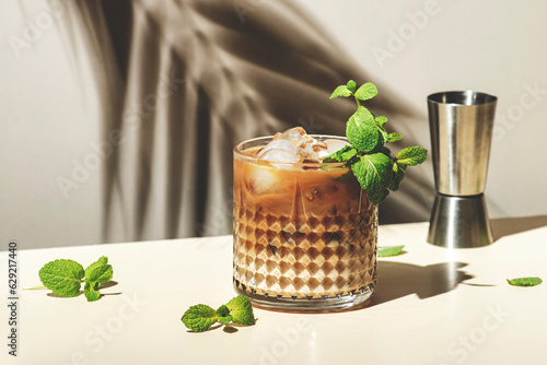 Fotografija Mint White Russian cocktail drink with vodka, coffee liqueur, mint schnapps, cre