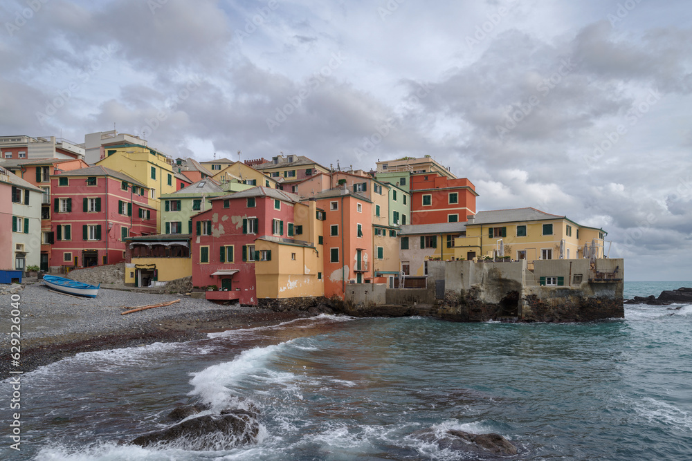 Boccadasse townscape by sea against storm clouds