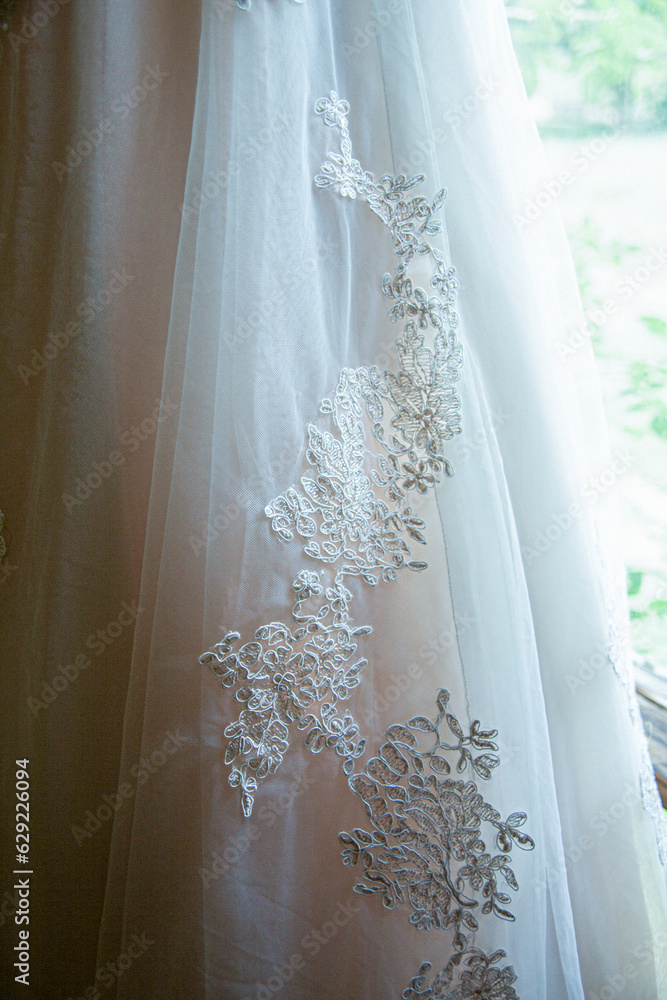 Detail of lace on wedding dress.