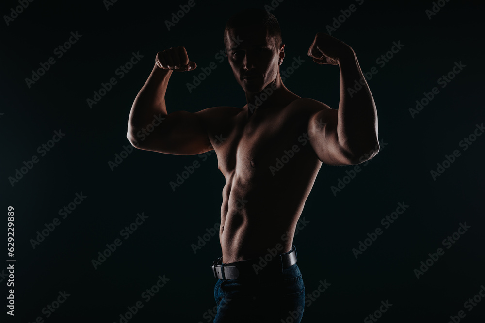 Good-looking and muscular man flexing his upper body Good-looking and muscular man flexing his upper body