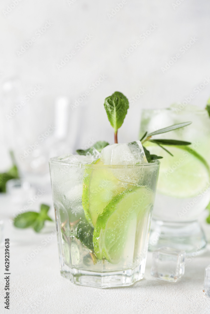Glass of tasty mojito on light background Glass of tasty mojito on light background