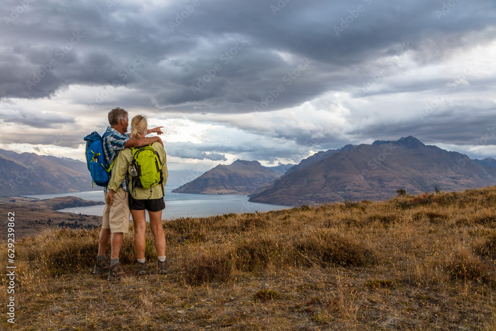Mature backpackers in New Zealand enjoying mountain travel