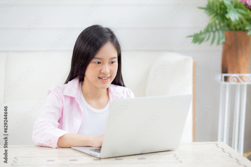 Beautiful young asian woman typing keyboard on laptop computer on desk at home, businesswoman working online, freelance is female using notebook on table, communication and business concept. Beautiful young asian woman typing keyboard on laptop computer on desk at home, businesswoman working online, freelance is female using notebook on table, communication and business concept.