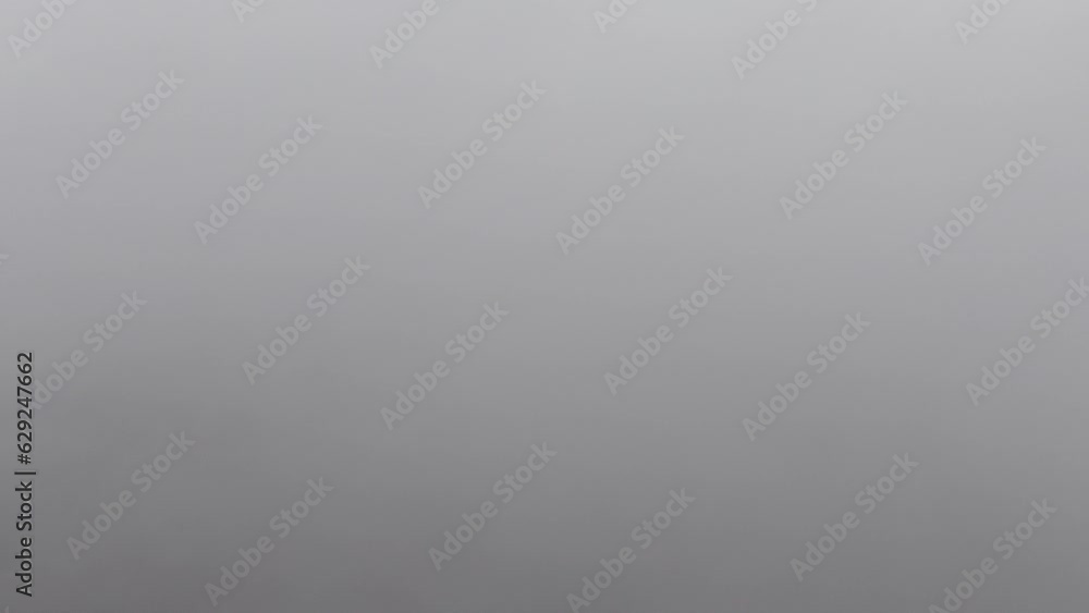 Landscape view of stormy cloudscape with gray sky and vague horizon for wallpaper