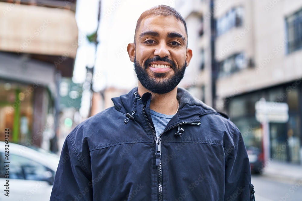 Young hispanic man smiling confident standing at street Young hispanic man smiling confident standing at street
