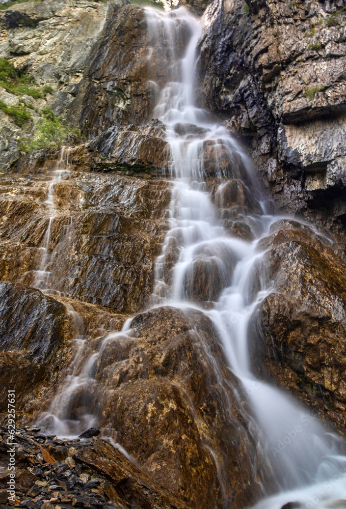 waterfall between rocks in Altai mountains waterfall between rocks in Altai mountains