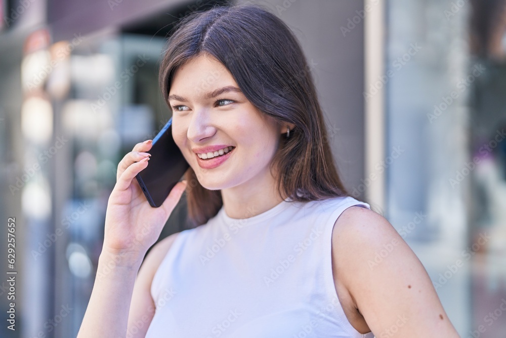Young caucasian woman smiling confident talking on the smartphone at street Young caucasian woman smiling confident talking on the smartphone at street