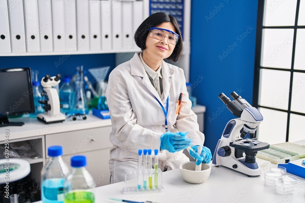 Young chinese woman scientist working at laboratory Young chinese woman scientist working at laboratory