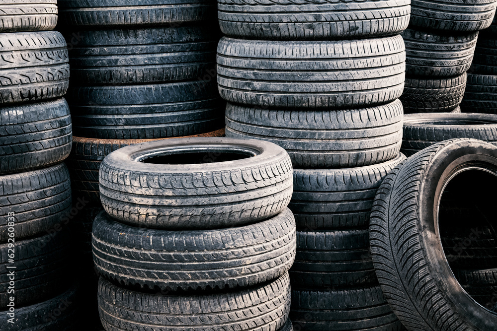 Stack of used car tires. Rubber tire dump Stack of used car tires. Rubber tire dump