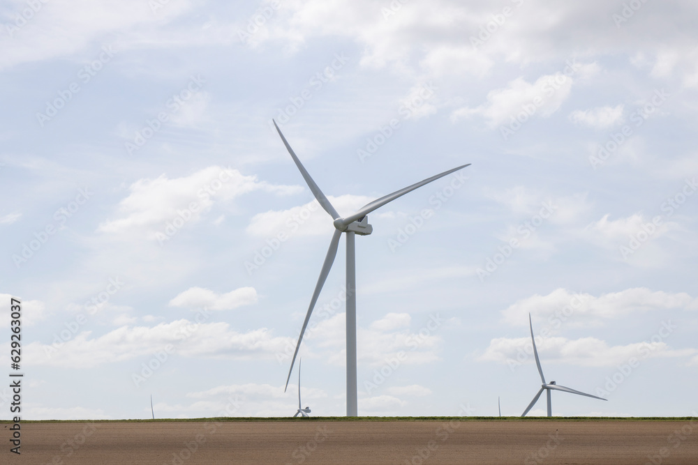 Windmills for electricity generation. Wind turbine farm, windmill farm producing green energy Windmills for electricity generation. Wind turbine farm, windmill farm producing green energy
