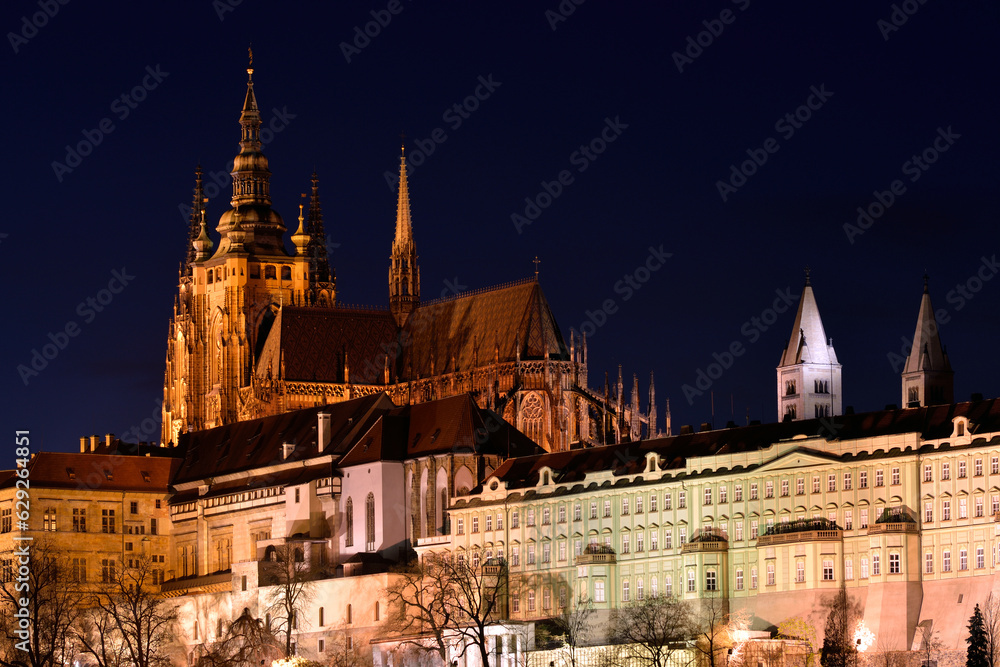 Illuminated cathedral in Prague old town at night time