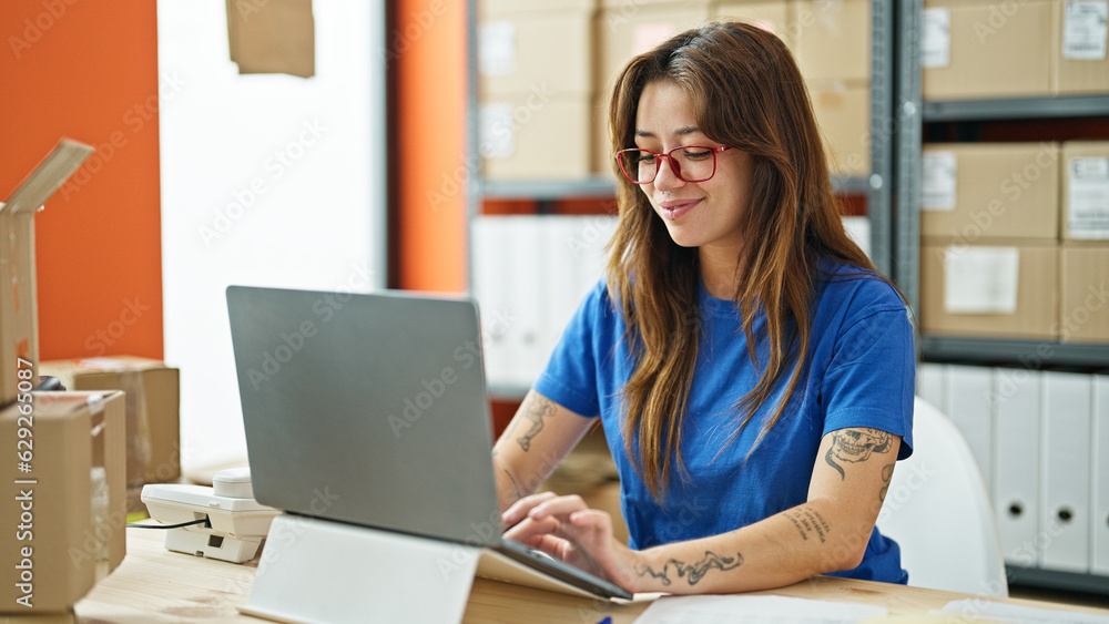 Young beautiful hispanic woman ecommerce business worker using laptop working at office Young beautiful hispanic woman ecommerce business worker using laptop working at office