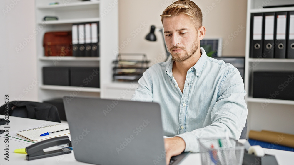Young caucasian man business worker using laptop working at office Young caucasian man business worker using laptop working at office