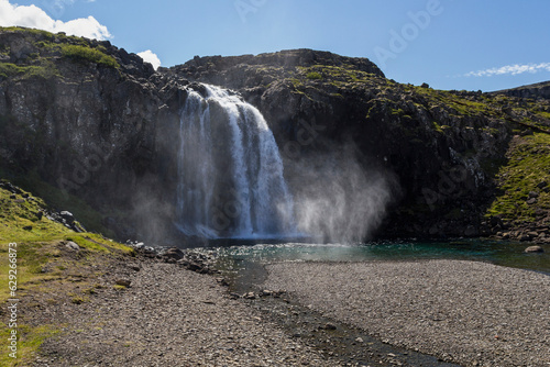 the Fossfj  r  ur waterfall in iceland at summer