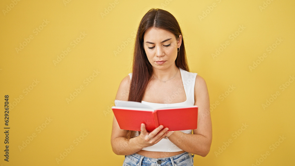 Young beautiful hispanic woman reading book thinking over isolated yellow background