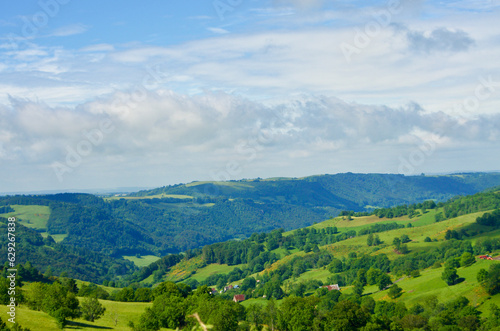 Fototapeta Naklejka Na Ścianę i Meble -  Fresh green landscape with volcano mountains in Auvergne in France.