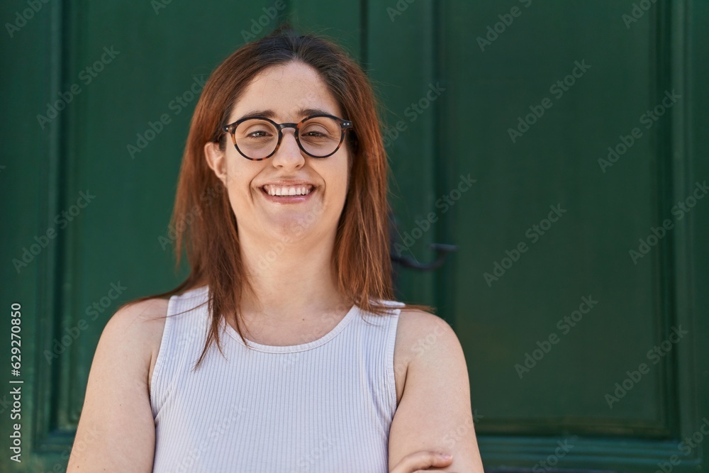 Young woman smiling confident wearing glasses at street Young woman smiling confident wearing glasses at street