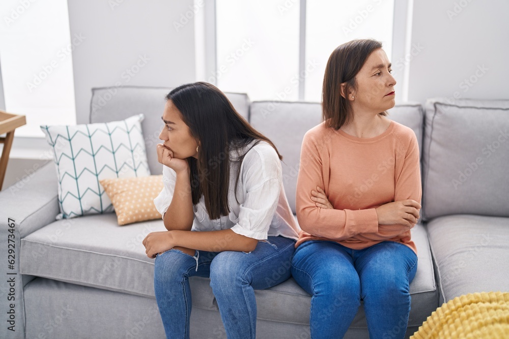 Two women mother and daughter arguing at home Two women mother and daughter arguing at home