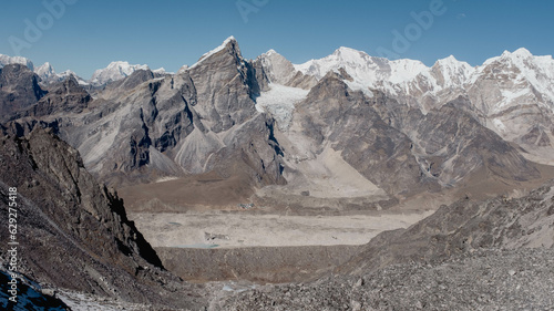 View of a majestic snow-capped mountain range with a rugged terrain