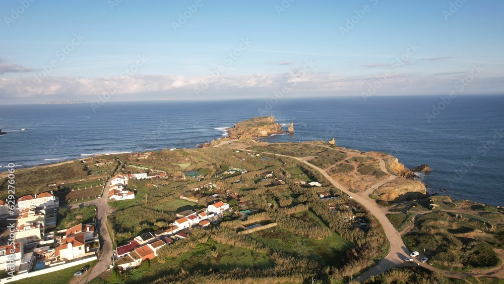 Fototapeta premium Picturesque view of Peniche Portugal, featuring winding roads leading up to a stunning beach