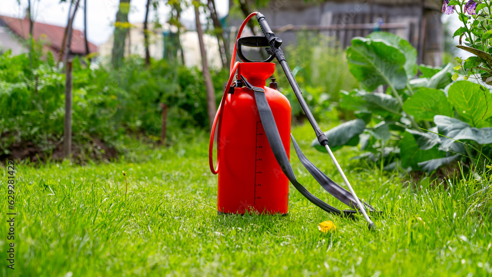 Orange containers for spraying pesticides Orange containers for spraying pesticides