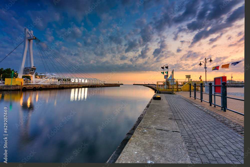Beautiful sunrise over the Ustka habour by the Baltic Sea, Poland.