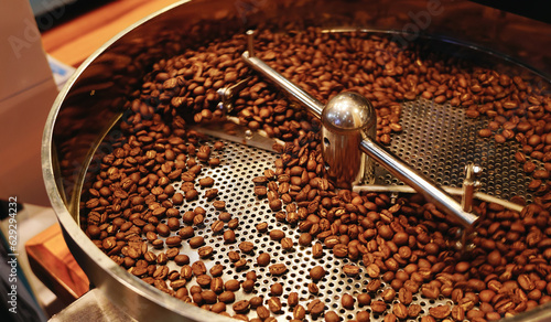 coffee beans in roast machine. Fragrant coffee beans are roasted, hot aroma coffee and organic freshness, roast coffee industry cooked.