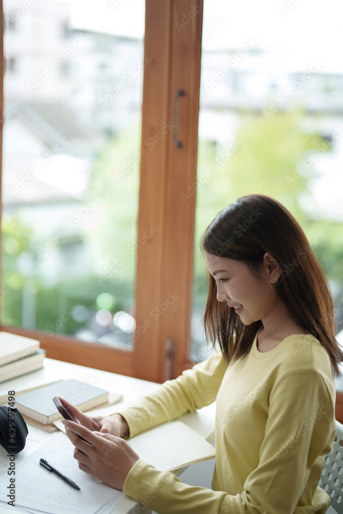 Asian university female millennials or generation z using smart phone.. Asian university female millennials or generation z using smart phone..