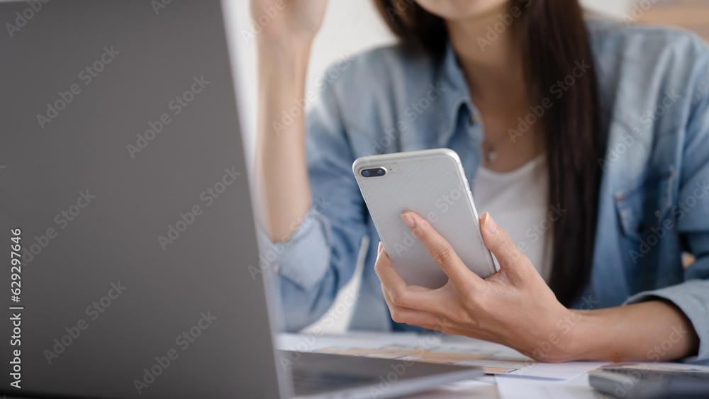 Working woman Asian Architects designer using smartphone with laptop Working woman Asian Architects designer using smartphone with laptop