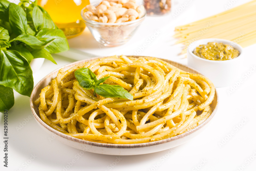 Spaghetti pasta with pesto sauce, basil, cashew and parmesan. Ingredients. 