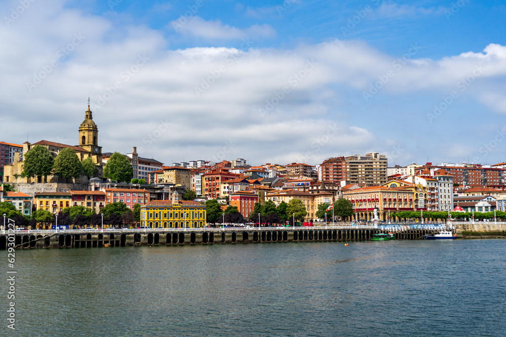 Portugalete town by Nervion river, and Sandra Maria basilica, Basque Country, Spain.