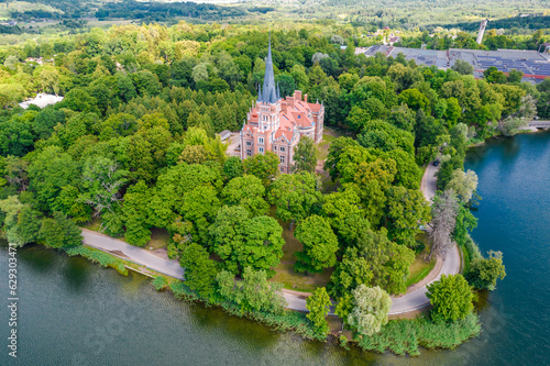 Palace Tyszkiewicz  Tiskeviciai manor  in Lentvaris on the coast of the lake  Lithuania. Aerial view of Tudor style castle