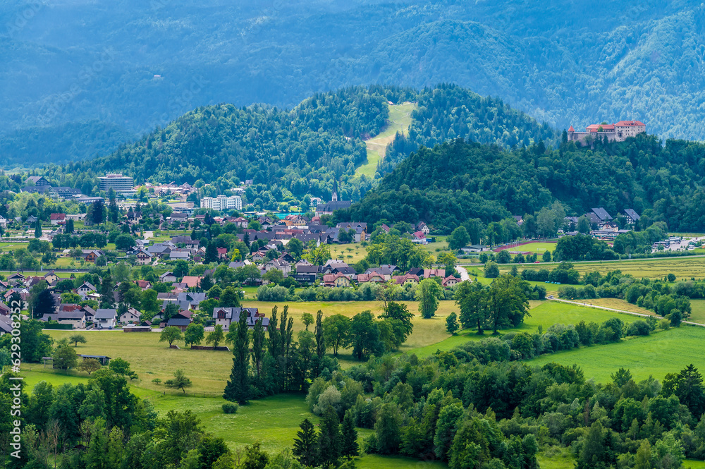 A view across the valley towards the settlements of Zgornje Gorje and Bled, Slovenia in summertime