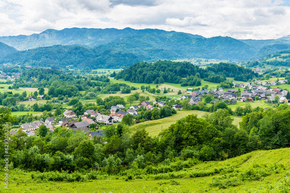 A view across the valley towards the settlements of Spodnje Gorje near Bled, Slovenia in summertime