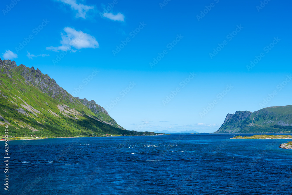 Summer sunny day at Lofoten, Norway, Nordland. Landscape with dramatic mountains and sea, ocean. fjord in the Lofoten Islands