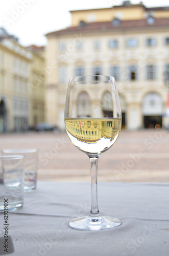 Glass of white wine at an outdoor cafe in Turin, Italy
