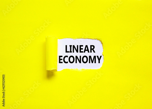 Linear economy symbol. Concept words Linear economy on beautiful white paper. Beautiful yellow background. Business linear economy concept. Copy space.