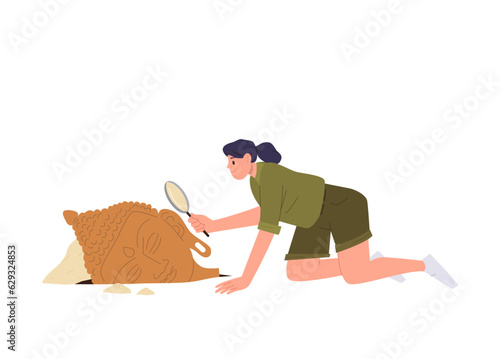 Woman archeologist using magnifying glass for examining antiquity excavated historical artifacts