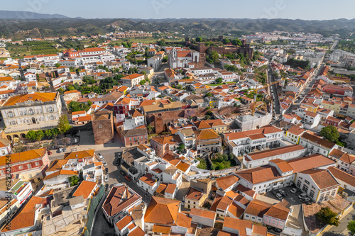Aerial view of Silves town with famous medieval castle and Cathedral, Algarve region, Portugal.