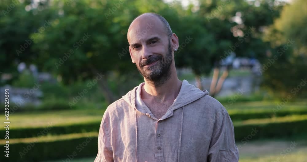A middle-aged man looks at the camera and makes flirtatious facial expressions, exuding charm and coquettishness A middle-aged man looks at the camera and makes flirtatious facial expressions, exuding charm and coquettishness