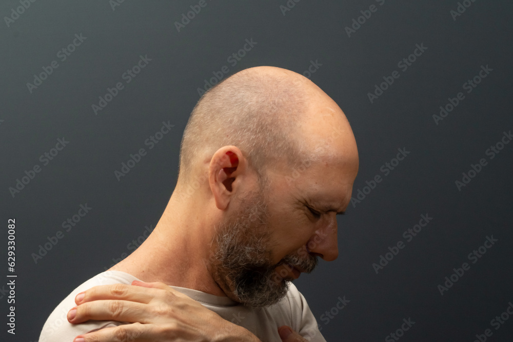 Man in his 50s, emotionally shaken showing stress or pain gesture. Feeling weak or depressed. Man in his 50s, emotionally shaken showing stress or pain gesture. Feeling weak or depressed.
