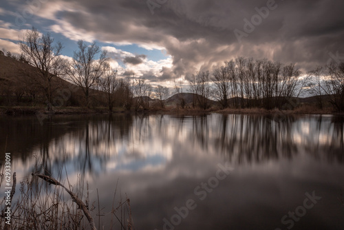 Perfectly symmetric clouds and trees reflections on Colfiorito Umbria swamp