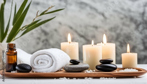 Spa treatment items on white wooden table with marble wall