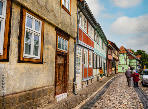 small town with old vintage small colored houses and old cobblestone pavement © Elena