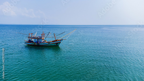 A small fishing boat floating in the sea