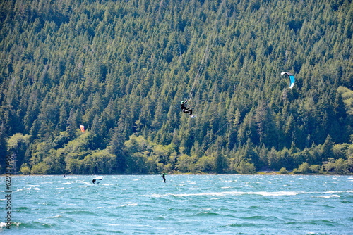 Kiteboarding at Nitinat Lake on Vancouver Island, BC, Canada. Nitinaht is one of the best kiteboarding locations in Canada because of its steady and consistent winds. photo