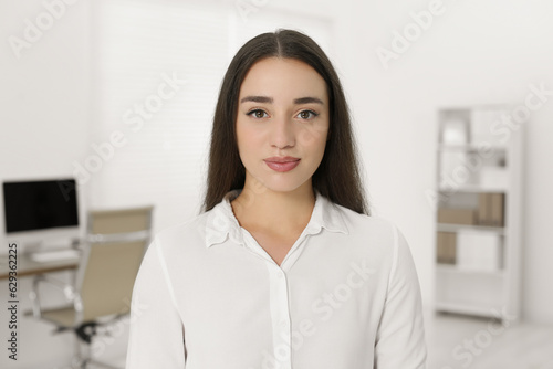 Portrait of beautiful young woman in office Free Download Portrait of beautiful young woman in office - GFXLoad