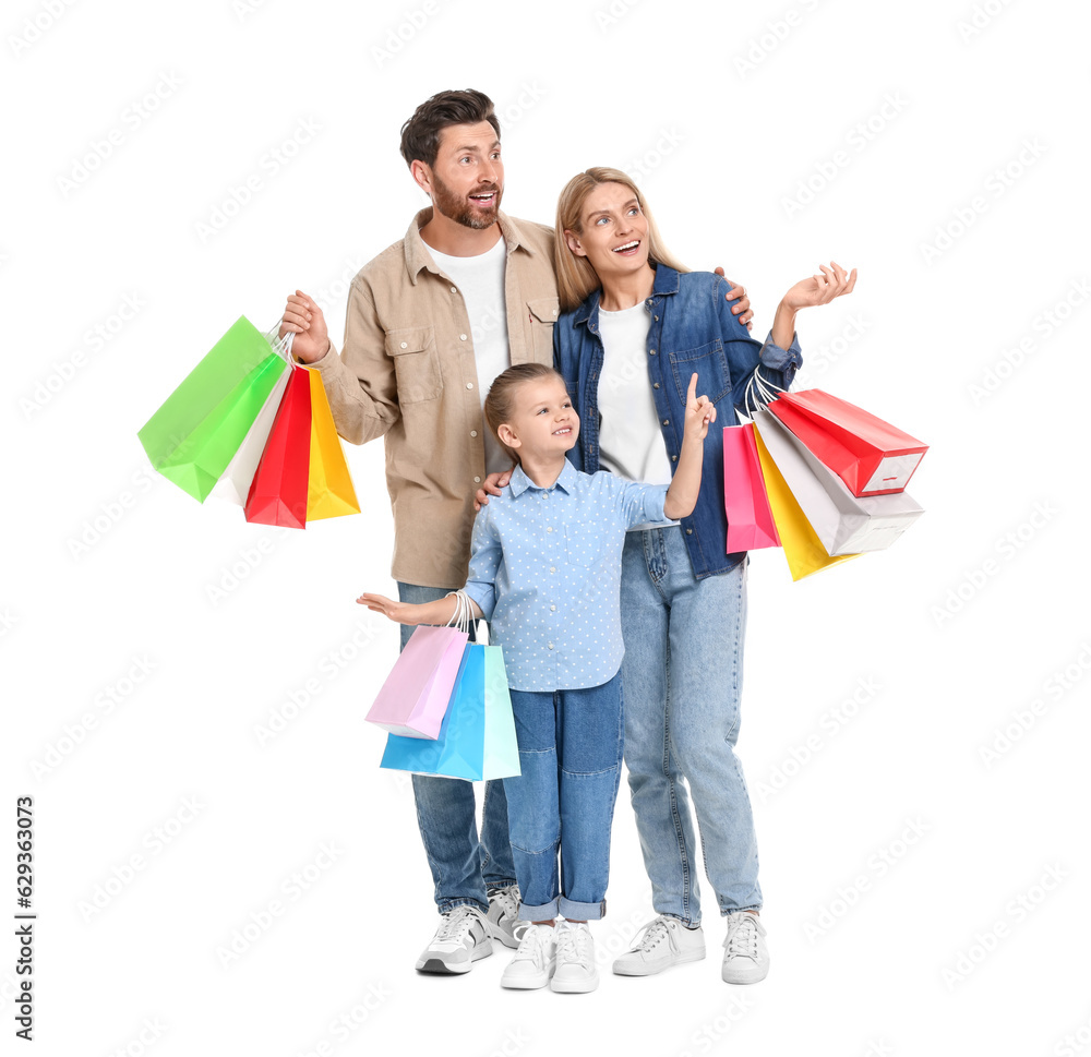 Family shopping. Happy parents and daughter with many colorful bags on white background Family shopping. Happy parents and daughter with many colorful bags on white background